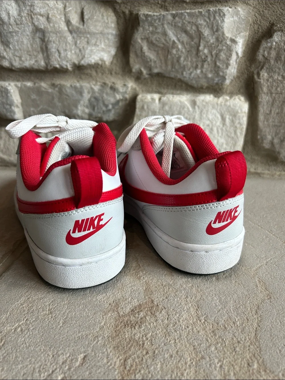 Nike Youth White Leather Low-Top Sneakers with Red Swoosh and Red Lining